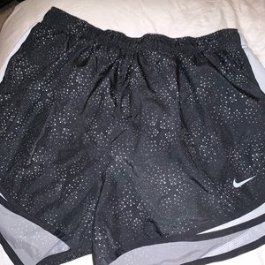 black nike shorts with white dotted design